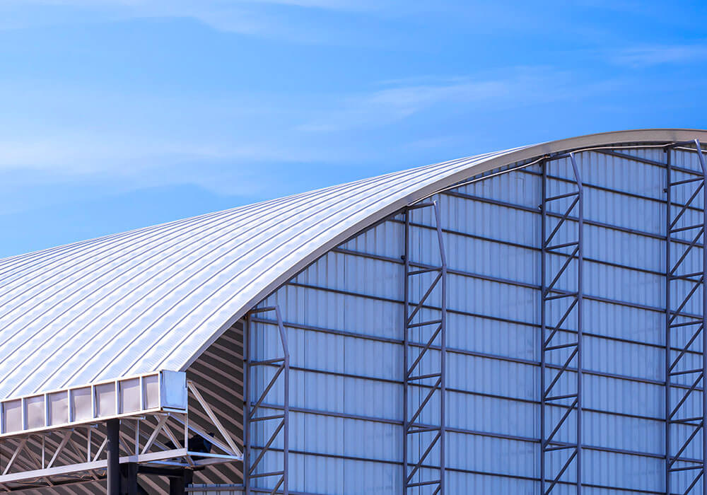 Commercial building with metal cladding, flashing, and roofing