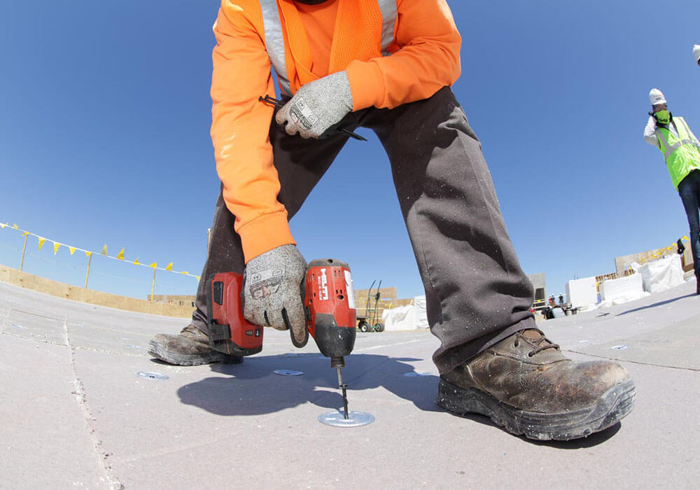 Commercial Roofing Contractor Installing Flat Roof System