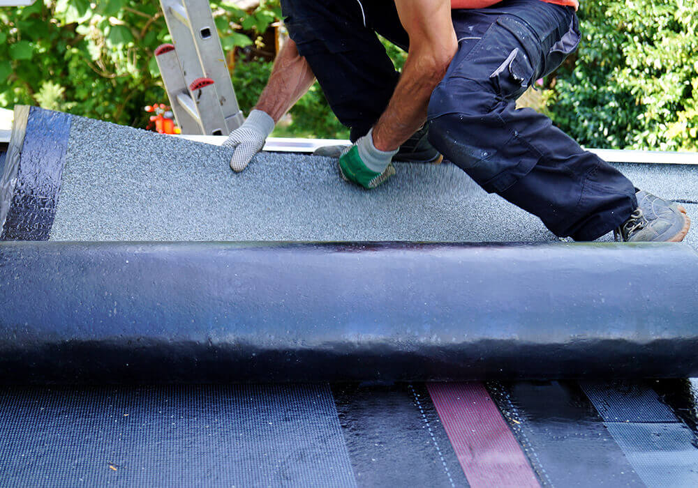 Flat roof contractor replacing flat roof system in New York